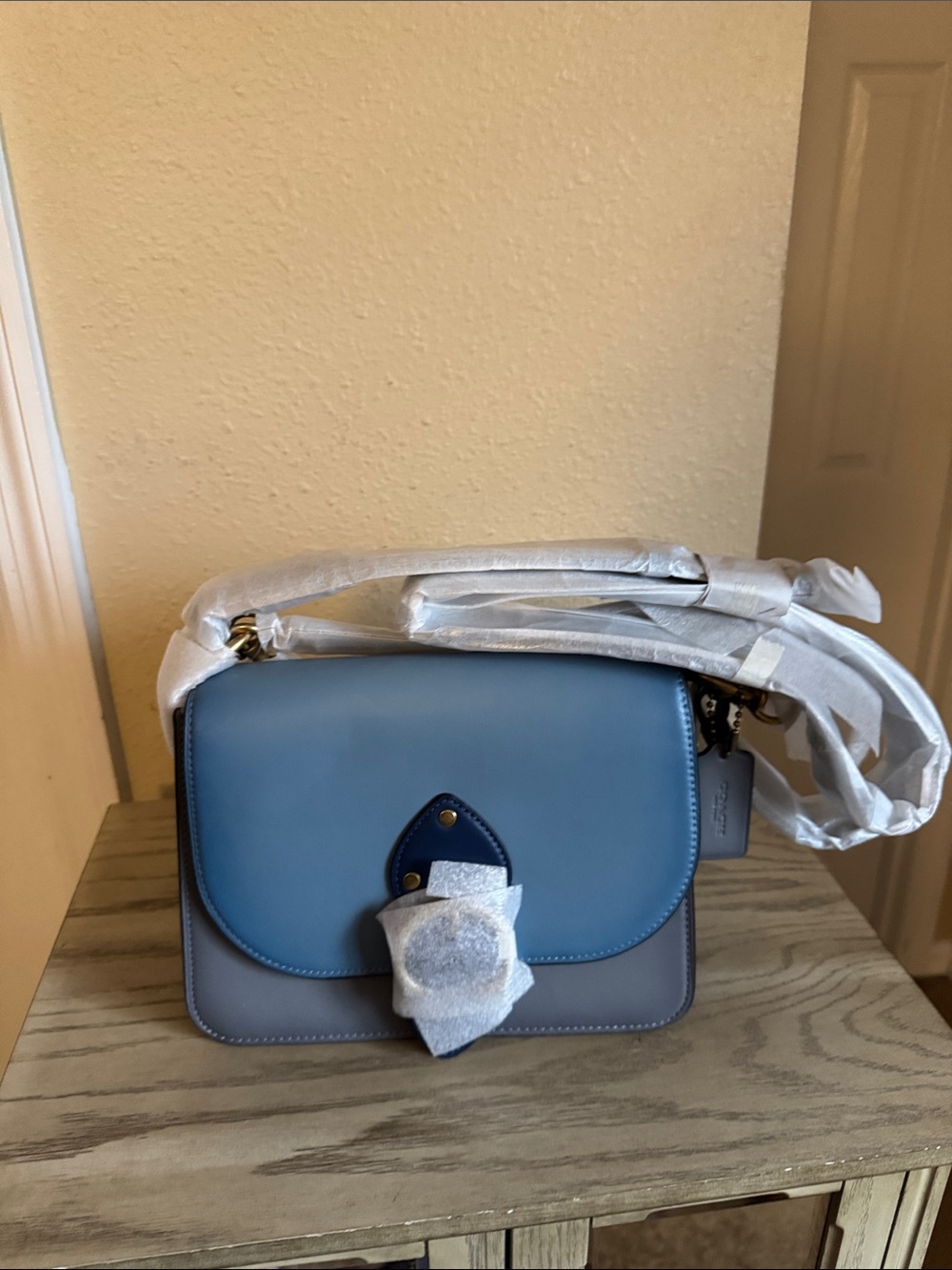 New with tags coach blue and grey color block crossbody beat bag. With chain.